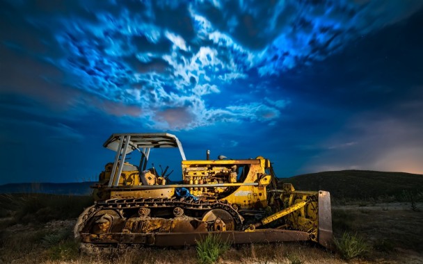 Premium AI Image | Construction scene Caterpillar excavator digs with force  against blue sky near concrete pipe Vert